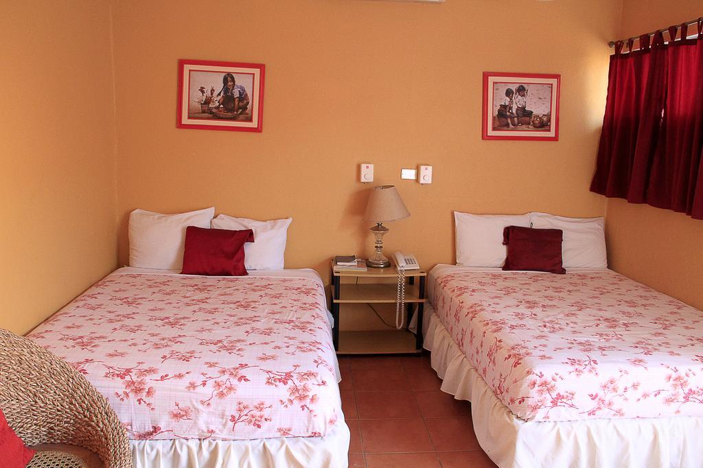 Hotel Y Apartments Los Cisneros Manágua Quarto foto